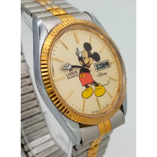 1169 - A Lorus Quartz Mickey Mouse Watch. Two tone expandable strap. Two tone case - 36mm. Cream dial with ... 