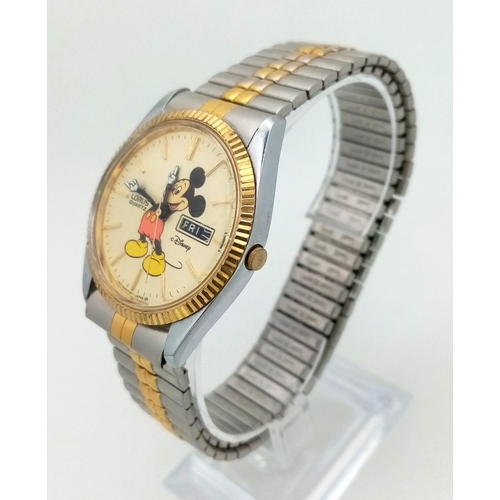 1169 - A Lorus Quartz Mickey Mouse Watch. Two tone expandable strap. Two tone case - 36mm. Cream dial with ... 