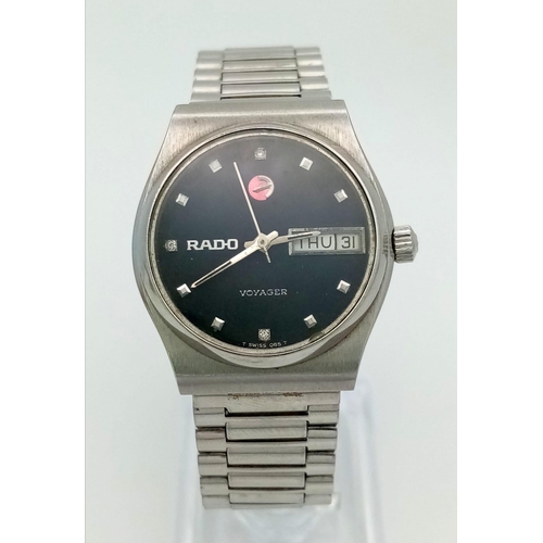 118 - A Vintage Rado Voyager Automatic Gents Watch. Stainless steel strap and case - 32mm. Black dial with... 