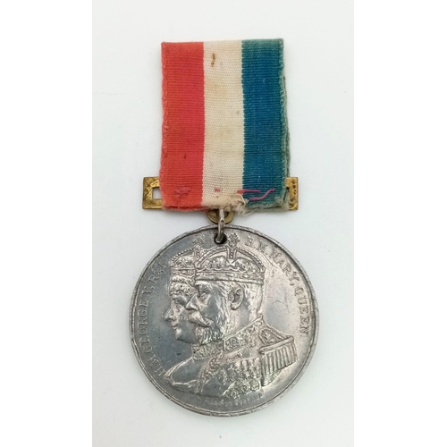 1266 - A 1911 George V and Queen Mary Commemorative Medal.