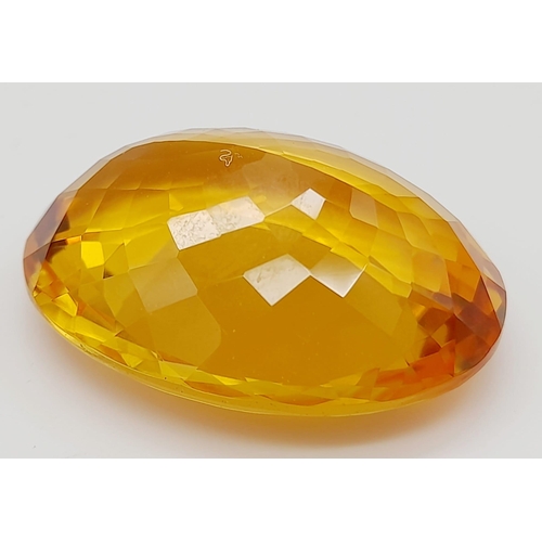 168 - A gorgeous, large (51.05 carats) citrine. Oval cut with strong colour saturation and uniformity. Fla... 