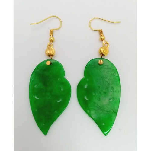 210 - A spectacular, intricately carved, green jade, pair of earrings. Exquisitely presented in a Chinese,... 