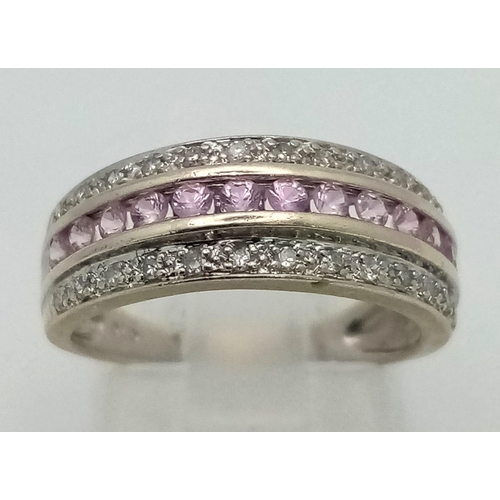 422 - A 9K White Gold Three Row Diamond and Amethyst Ring.  
Size L. 3.08g total weight.