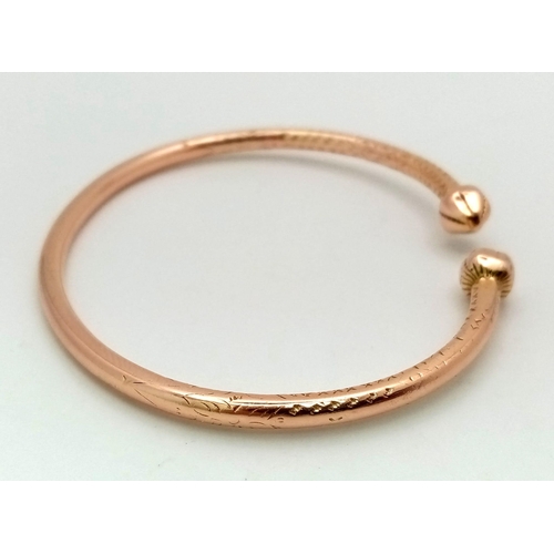 58 - A Heavy Solid 14k Rose Gold (tested) Cuff Bangle. 6.5cm inner diameter. 27.26g