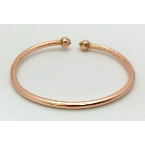 58 - A Heavy Solid 14k Rose Gold (tested) Cuff Bangle. 6.5cm inner diameter. 27.26g