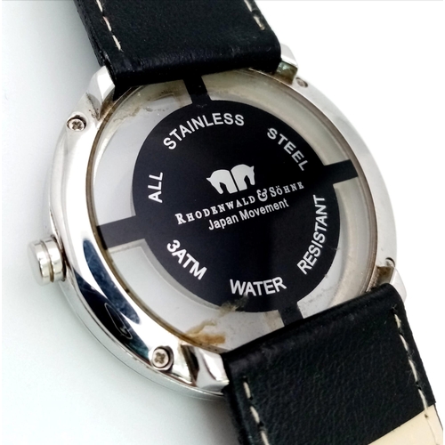 861 - A Rhodenwald and Sohne Designer Gents Watch. Black leather strap. Stainless steel case - 42mm. Float... 