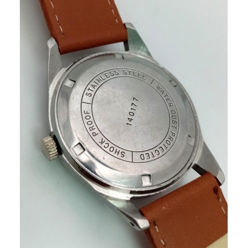 882 - A Vintage HMT Janata 17 Jewel Parashock Gents Watch. Brown leather strap. Stainless steel case - 35m... 