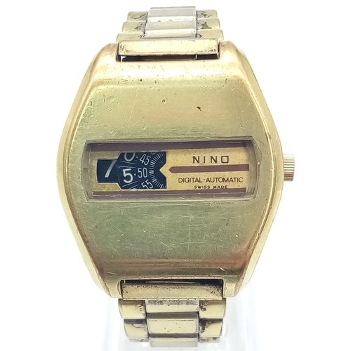 125 - A Vintage Nino Digital-Automatic Gents Watch. Two-tone strap and case - 38mm. In working order.