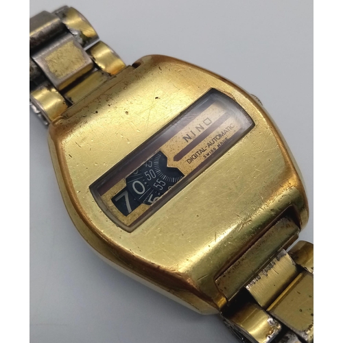 125 - A Vintage Nino Digital-Automatic Gents Watch. Two-tone strap and case - 38mm. In working order.