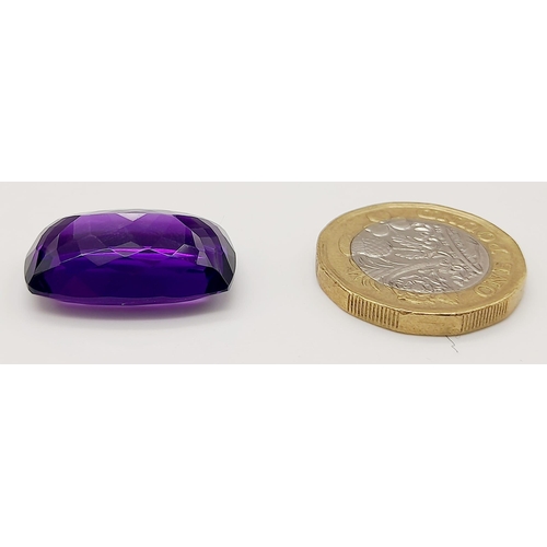 203 - A very admirable, large (22.85 carats) amethyst. Cushion cut, with strong colour saturation and unif... 