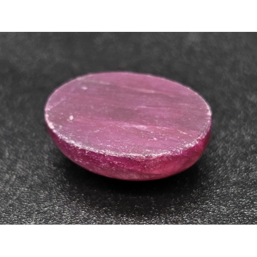 1036 - A 13.34ct Natural Ruby in an Oval Cabochon shape. Color Enhanced. Come with the IGL&I Certificate