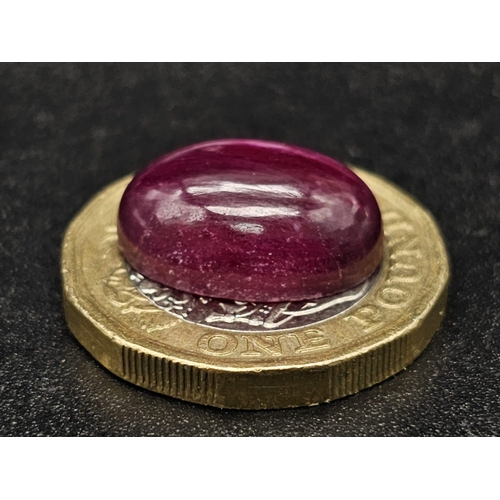 1036 - A 13.34ct Natural Ruby in an Oval Cabochon shape. Color Enhanced. Come with the IGL&I Certificate