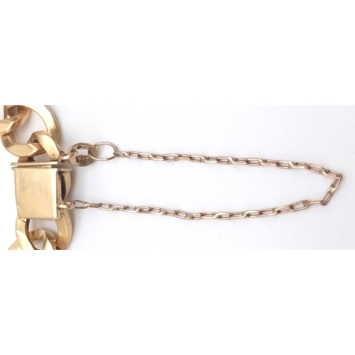 105 - A unisex, 18 K yellow gold identity bracelet with safety chain in a presentation case. Length: 22 cm... 