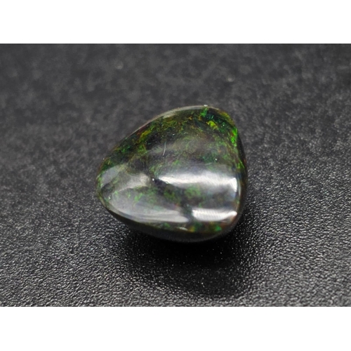 1064 - A 4.20ct Natural Black Fire Opal, in a Pear Cabochon Shape. Come with the GLI Certificate.