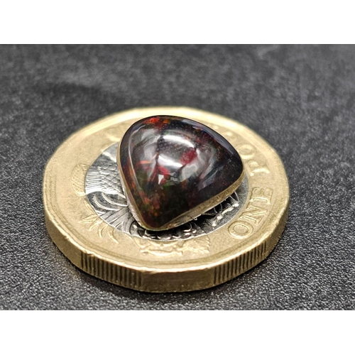 1064 - A 4.20ct Natural Black Fire Opal, in a Pear Cabochon Shape. Come with the GLI Certificate.