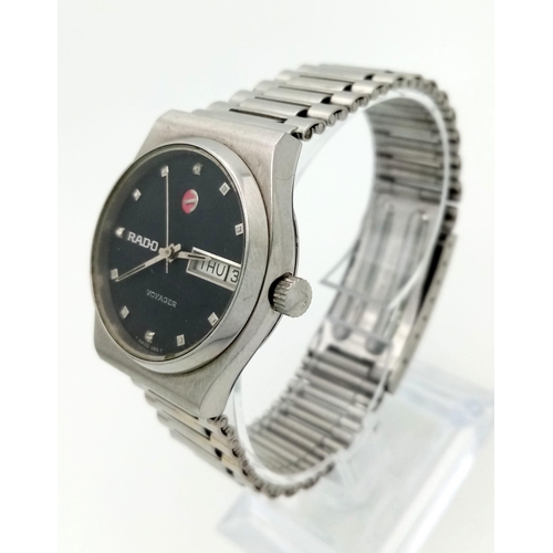 118 - A Vintage Rado Voyager Automatic Gents Watch. Stainless steel strap and case - 32mm. Black dial with... 