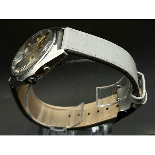 1197 - A Vintage Ricoh Automatic Gents Watch. Grey leather strap. Stainless steel case - 40mm. Two tone dia... 