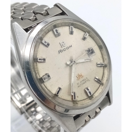 1238 - A Vintage Ricoh Automatic 21 Jewel Gents Watch. Stainless steel strap and case - 38mm. Cream dial wi... 