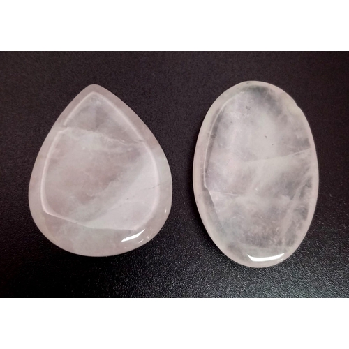 1302 - A Lot of 2 Cabochon Rose Quartz. Included: a 57.705ct Oval and a 73.15ct Pear