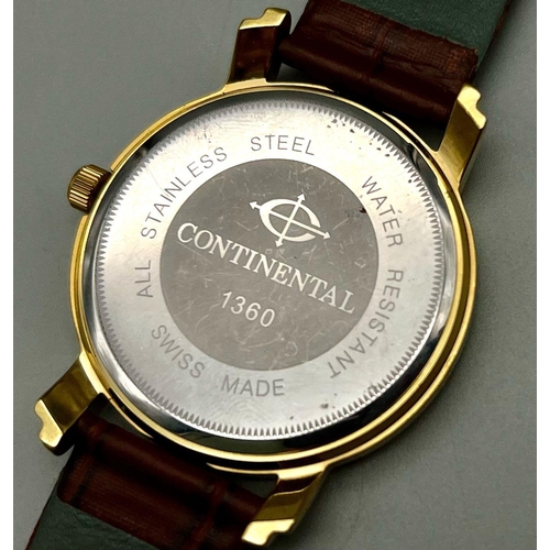 132 - A Continental 1360 Quartz Gents Watch. Brown leather strap. Two tone steel case - 42mm. Yellow and b... 