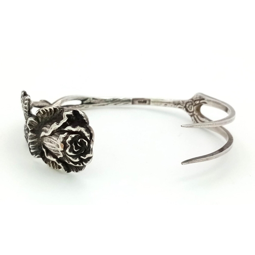 140 - A mid to late 19th Century German silver bracelet made from a dessert fork with a beautiful rose des... 