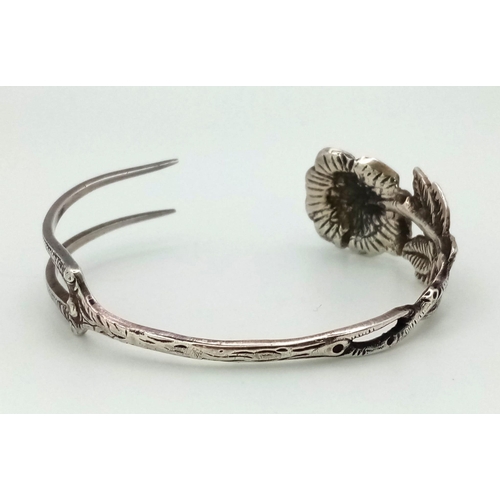 140 - A mid to late 19th Century German silver bracelet made from a dessert fork with a beautiful rose des... 