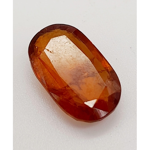 1420 - A 6.90ct Faceted Natural Hessonite Garnet, in an Oval Shape cut. Come with the GLI Certificate.