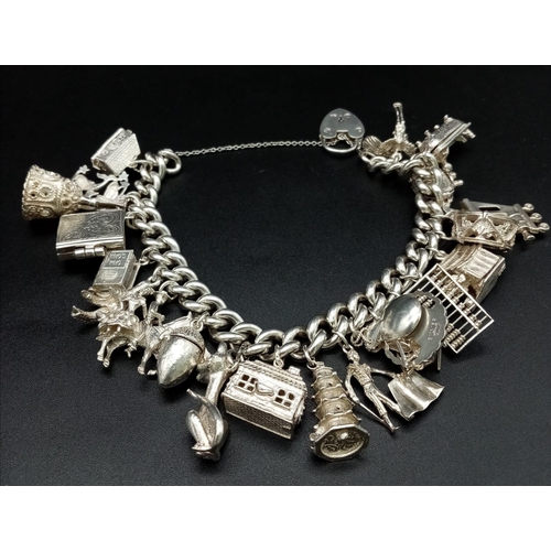 148 - A 925 Silver Charm Bracelet with an Eclectic Mix of 22 Charms. Including: Pisces, bathtub and a driv... 