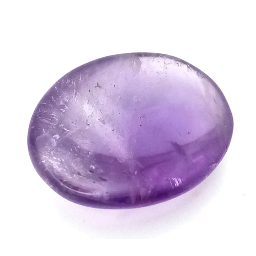 1511 - A 22.35ct Natural Amethyst, in an Oval Cabochon Shape. Comes with a GLI Certificate