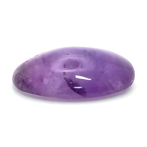 1511 - A 22.35ct Natural Amethyst, in an Oval Cabochon Shape. Comes with a GLI Certificate