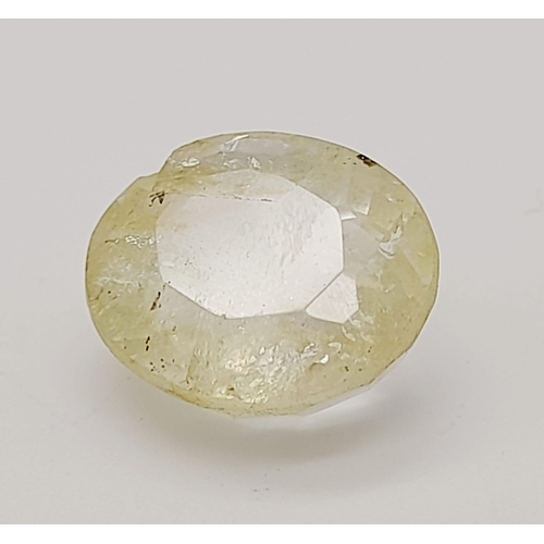 1518 - A 7.38ct Faceted Yellow Topaz, in an Oval mixed Shape. Color Enhanced. Come with the IGL&I Certifica... 