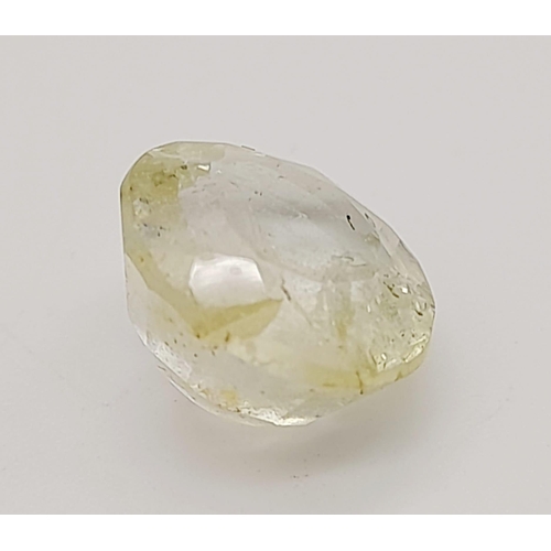 1518 - A 7.38ct Faceted Yellow Topaz, in an Oval mixed Shape. Color Enhanced. Come with the IGL&I Certifica... 