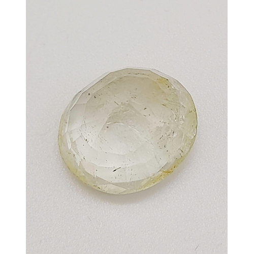 1518 - A 7.38ct Faceted Yellow Topaz, in an Oval mixed Shape. Color Enhanced. Come with the IGL&I Certifica... 