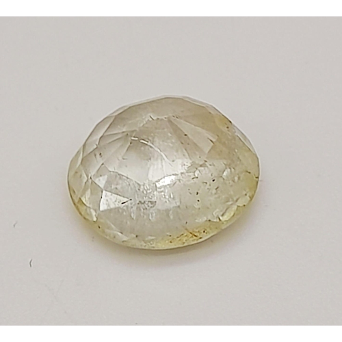 1518 - A 7.38ct Faceted Yellow Topaz, in an Oval mixed Shape. Color Enhanced. Come with the IGL&I Certifica... 