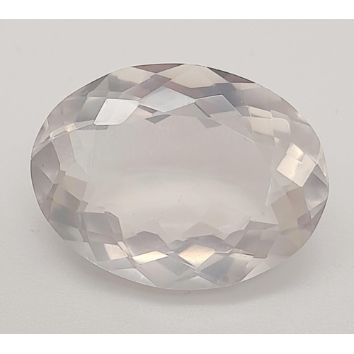 1779 - A 12.40ct Faceted Natural Rose Quartz in an Oval Shape. Come with the GLI Certified