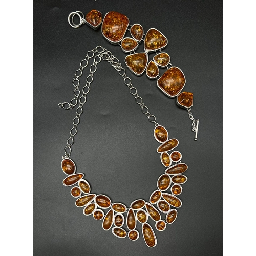 196 - A very substantial amber necklace and bracelet set in a presentation case. Total weight: 116 g