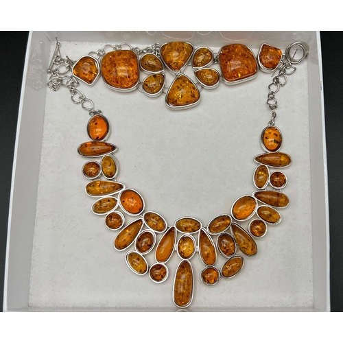 196 - A very substantial amber necklace and bracelet set in a presentation case. Total weight: 116 g