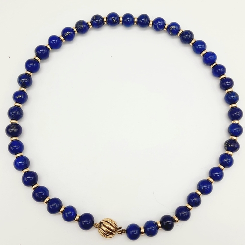 295 - A Gorgeous Lapis Lazuli Bead Choker Necklace with a 9K Gold (hallmarked) Globe Clasp. 8mm lapis bead... 