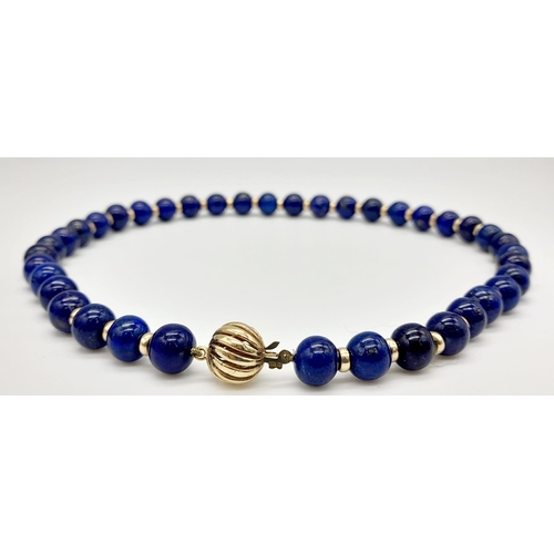 295 - A Gorgeous Lapis Lazuli Bead Choker Necklace with a 9K Gold (hallmarked) Globe Clasp. 8mm lapis bead... 