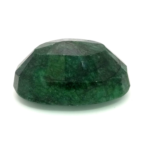 454 - A 628.40 Ct Faceted Emerald in an Oval Shape. Color Enhanced