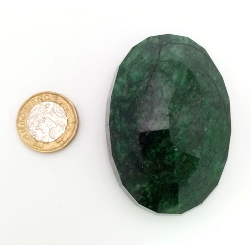 454 - A 628.40 Ct Faceted Emerald in an Oval Shape. Color Enhanced