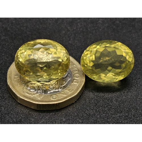 1295 - A Pair of 25ct Oval faceted Citrines.