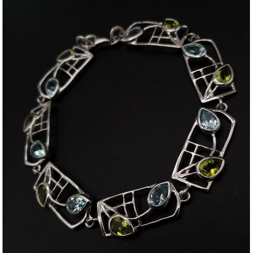 182 - A very elegant, Rennie Mackintosh design, sterling silver bracelet with pear cut aquamarines and per... 