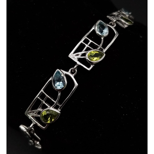 182 - A very elegant, Rennie Mackintosh design, sterling silver bracelet with pear cut aquamarines and per... 