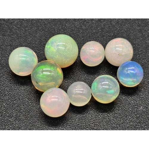 489 - 8.30ct White Fire Opal Spheres. Including 9pcs.