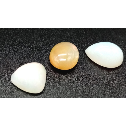 673 - A 6.80ct Ethiopian Multicolour Fire Opal Lot. Including 3 pcs. Cabochon. Pear & Oval Mixed. 2 whites... 