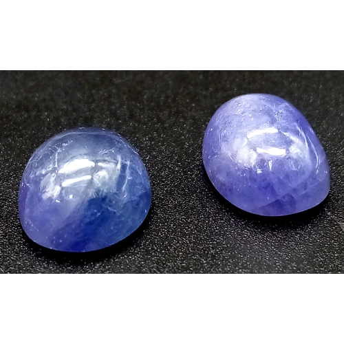 699 - 22.20 Pair of Oval Cabochon Natural Tanzanites.