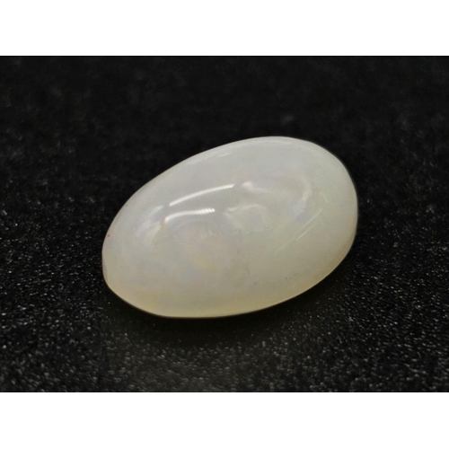 713 - A 3.5ct Natural White Fire Opal. Oval Cabochon. Comes with GLI Certificate.