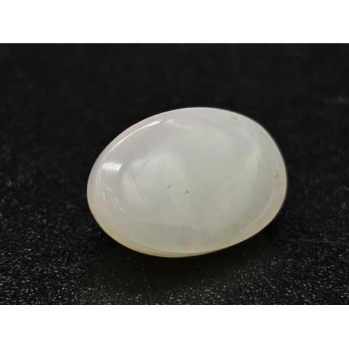 713 - A 3.5ct Natural White Fire Opal. Oval Cabochon. Comes with GLI Certificate.