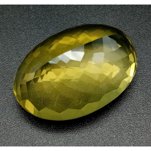 812 - A 50ct Natural Citrine. Oval cut. Approximately 27.9 x 19.7 x11.6 mm.